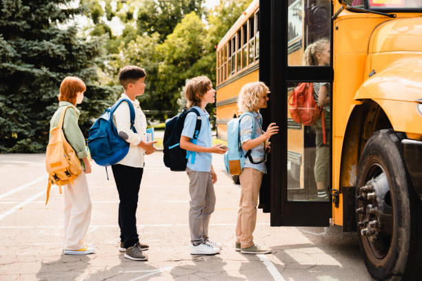 students boarding a school bus