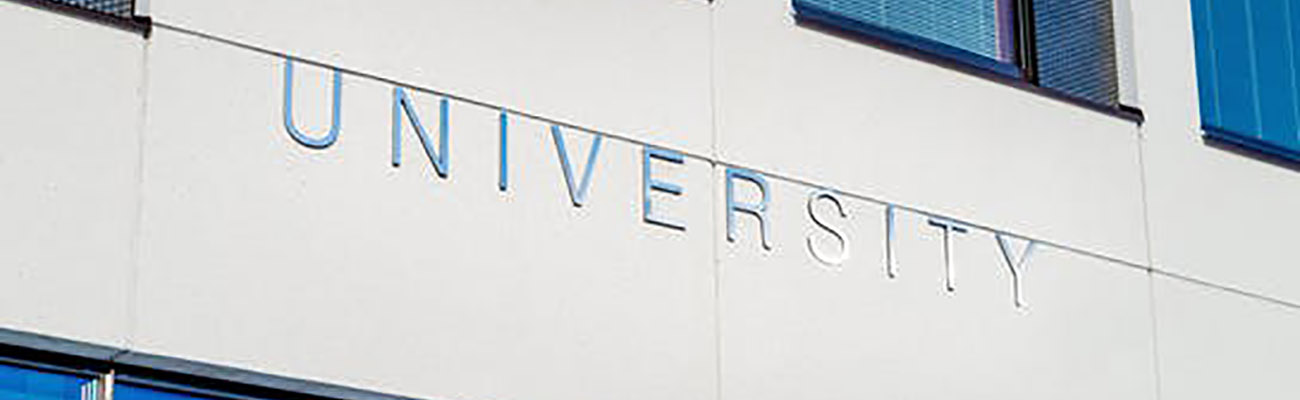 university sign on building